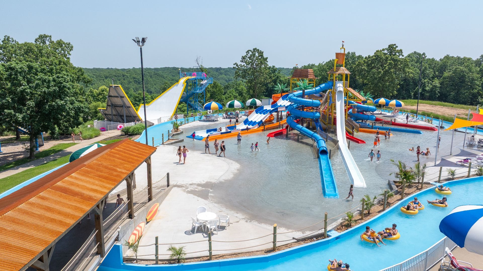 Aerial panorama of SuperSplash USA showing The Bowl, mat racer, Adventure Island slides, and lazy river